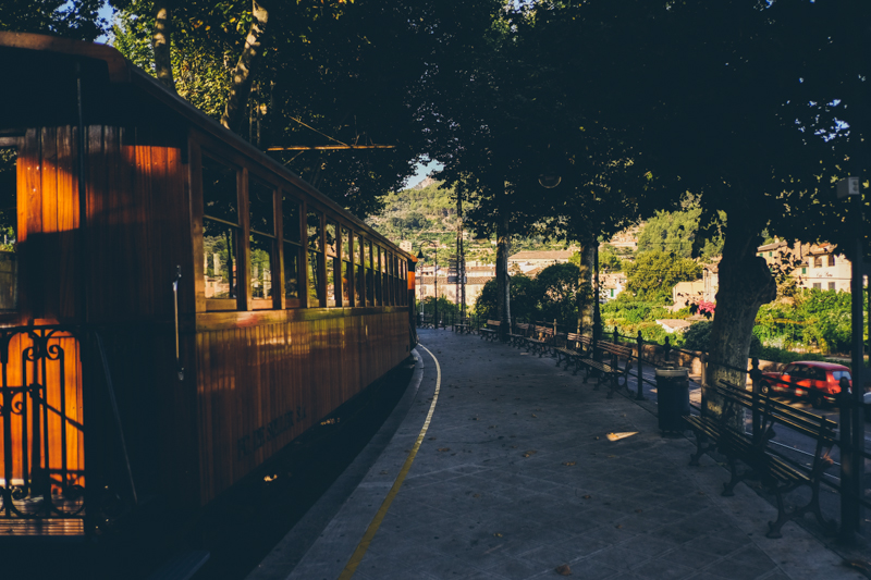 Wooden train in Soller in Mallorca, streets of the old town. Destination travel photography by destination wedding photographer Miss Gen Photography.