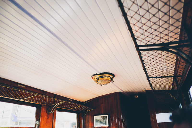 Inside the old wooden tram in Soller in Mallorca, streets of the old town. Destination travel photography by destination wedding photographer Miss Gen Photography.