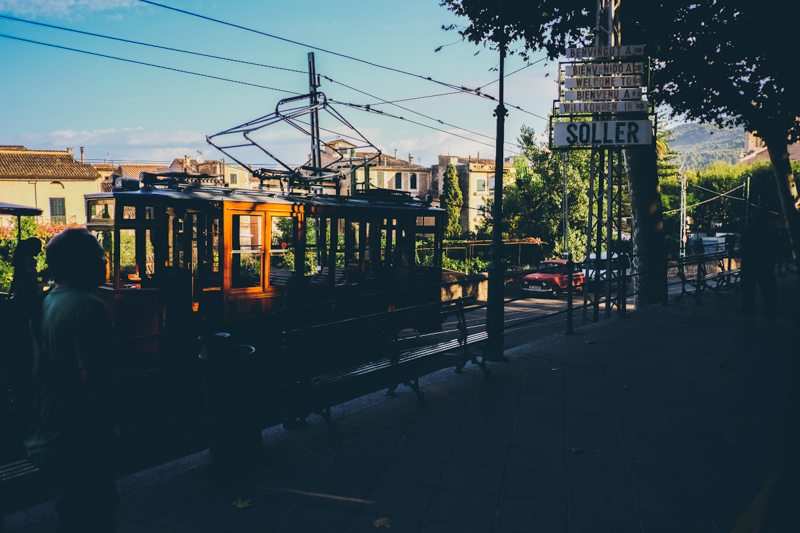 Old wooden tram in Soller in Mallorca, streets of the old town. Destination travel photography by destination wedding photographer Miss Gen Photography.