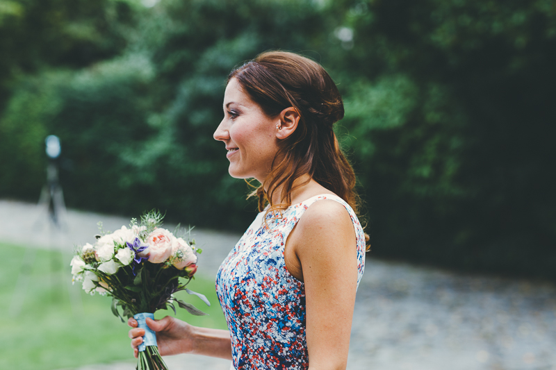 Bridesmaid with bouquet outside Portsmouth Registry Office