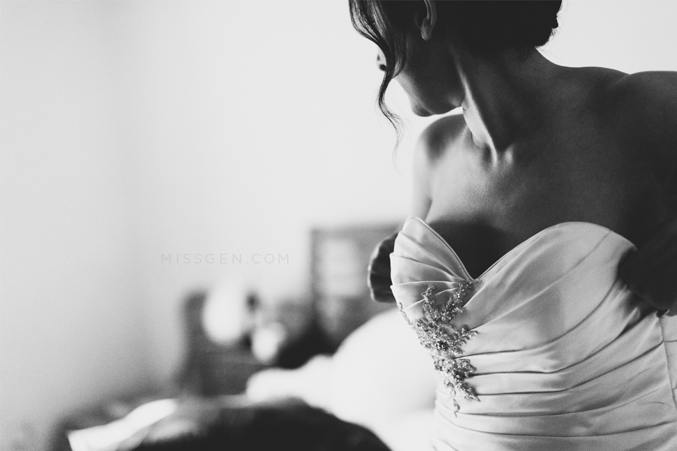 Beautiful, natural photo of Bride putting on her wedding dress. Bridal preparations. Thornbridge Hall wedding photography by Miss Gen Photography, London and destination wedding photographer.