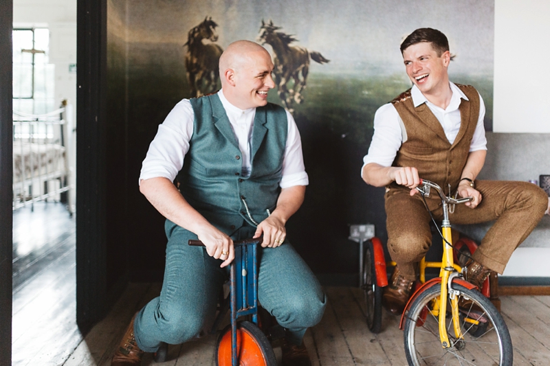 Two Grooms on mini bikes in tweed addict suits at One Friendly Place in London