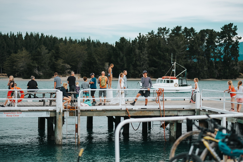 bride and goom on Mapua Wharf by nelson wedding photographer miss gen