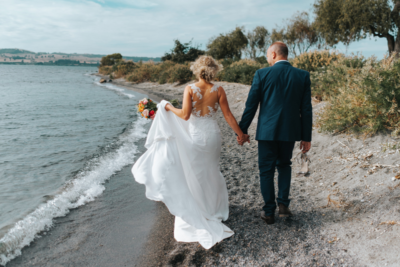 natural bride and groom portraits by lake taupo in new zealand by destination wedding photographer miss gen