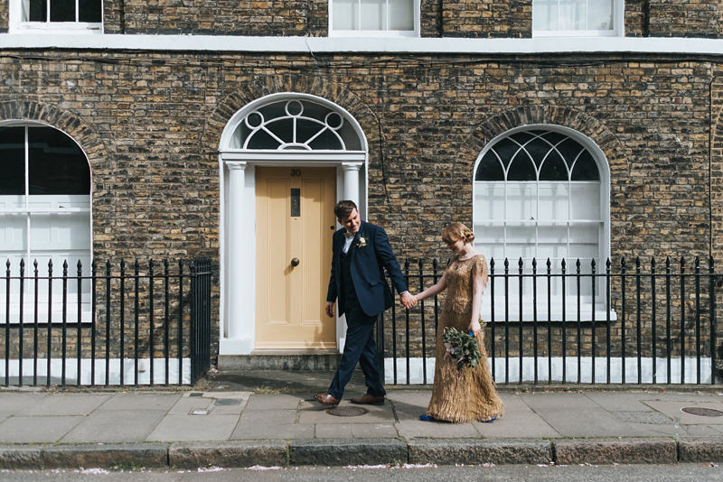 contemporary bride and groom portrait in London with bride in gold sequin dress by Eliza Jane Howell by destination wedding photographer Miss Gen